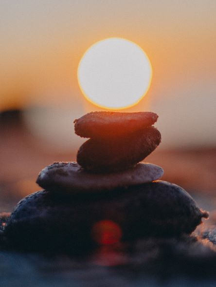 Stack of rocks in front of sunset